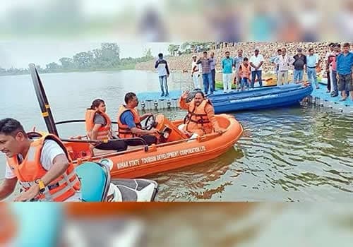 Bihar State Tourism Development Corporation boats on a river, crews in life jackets