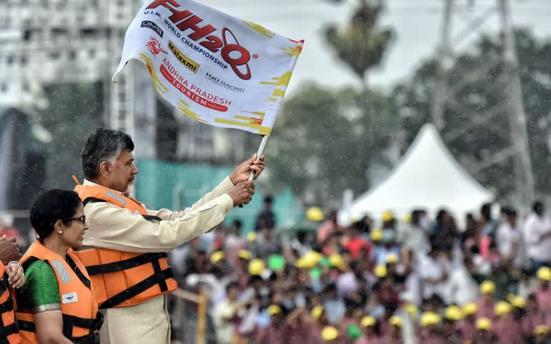 A festival crowd at the water with MM life jackets in use