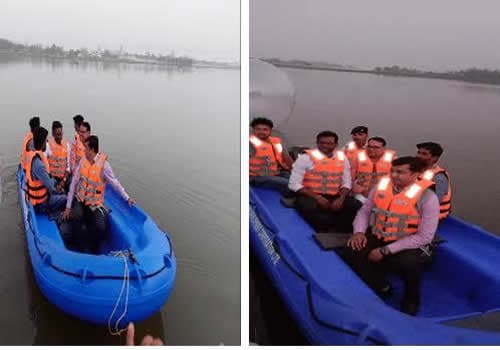 Paddlers on a river wearing MM life jackets