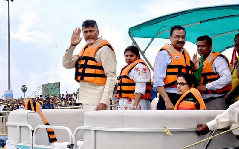 Officials aboard a boat at a public event in MM life jackets
