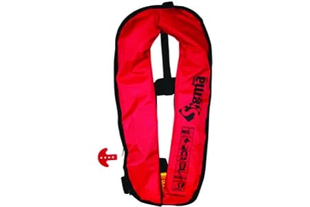 A red inflatable life jacket in its packed cover, uninflated, with the pull toggle at the side