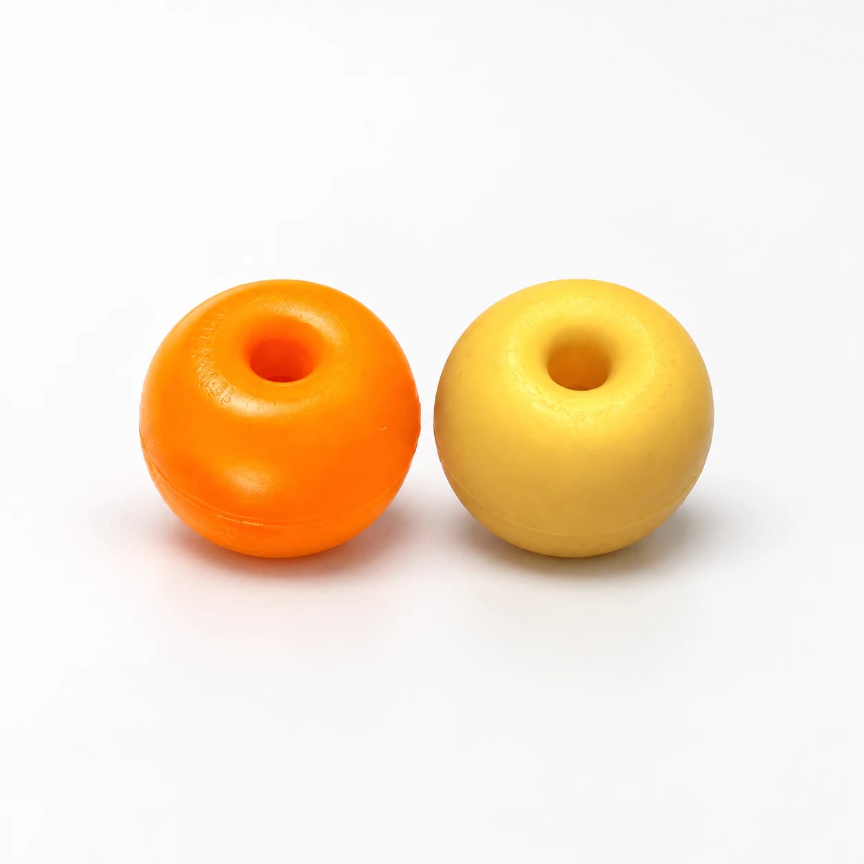 Two MM apple fishnet floats, orange and pale yellow, with centre holes